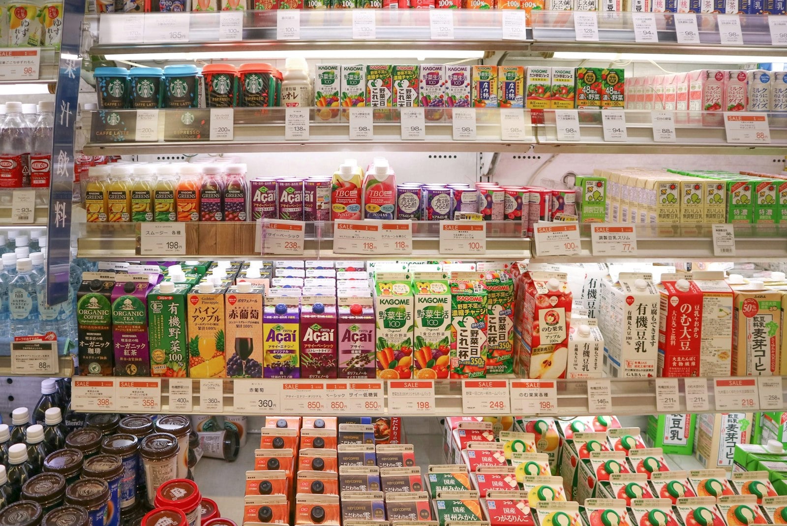 Japanese drinks and pantry goods arranged across brightly lit grocery shelves