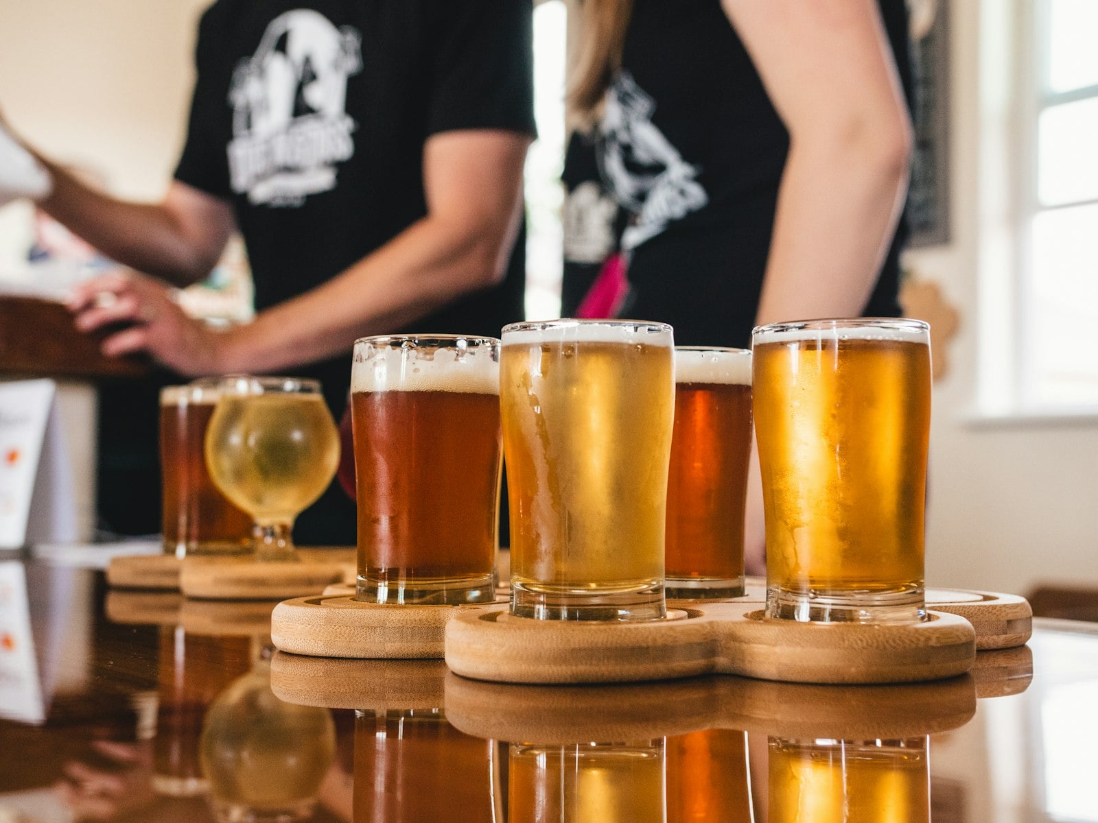 A glass of West Coast IPA on a San Diego brewery bar