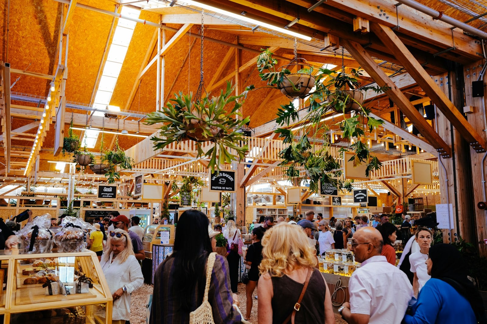 Counters and shared tables inside a busy indoor food hall