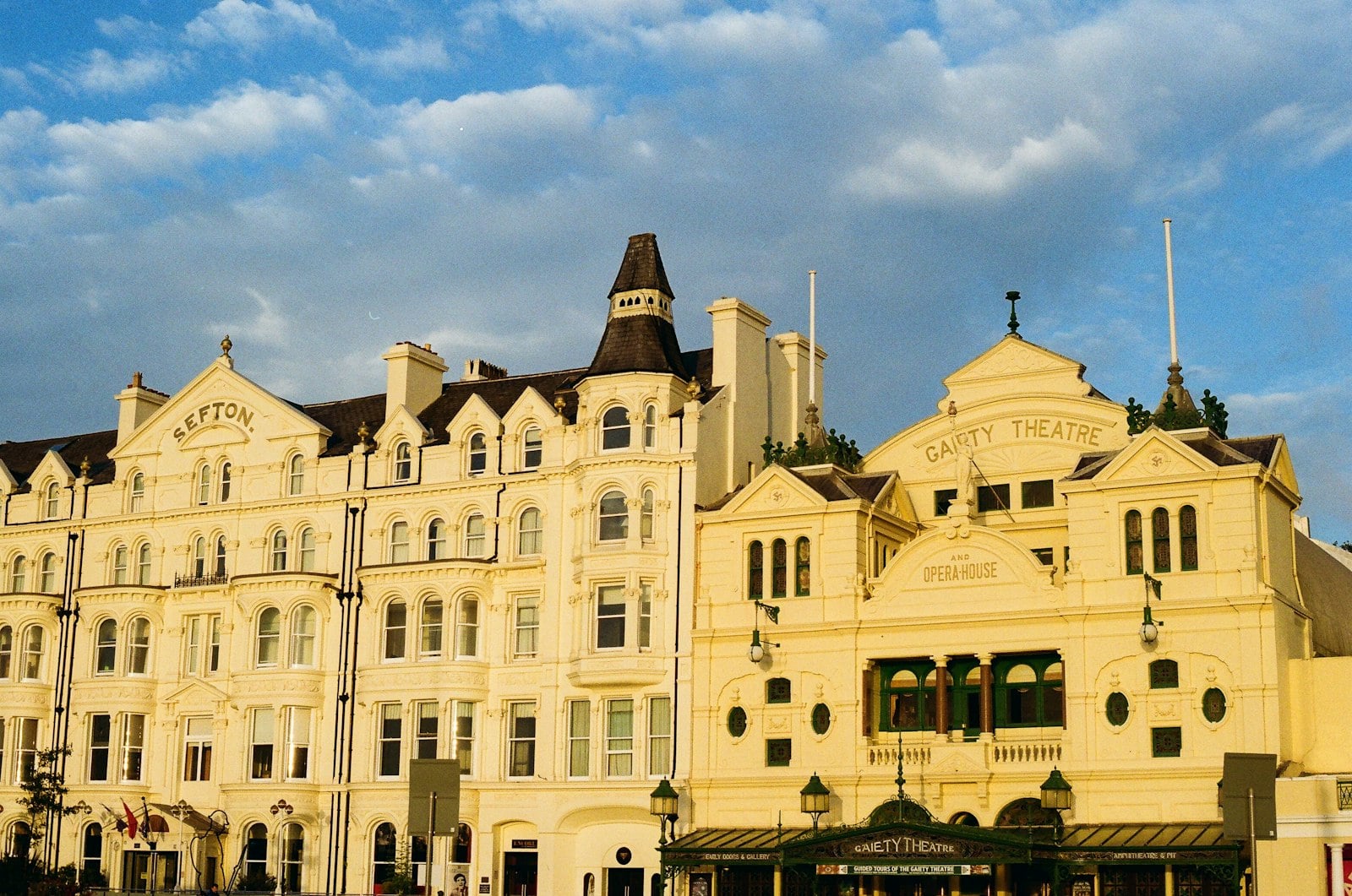 Ornate historic building fronts under a heavy grey sky