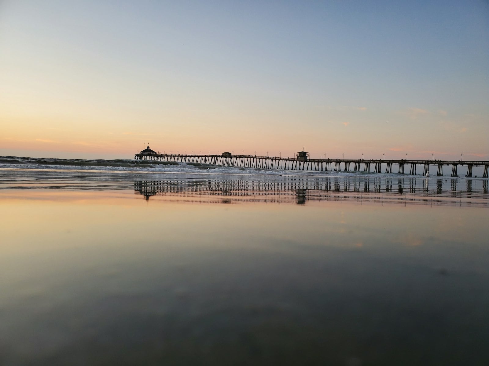 Imperial Beach pier and shoreline viewed from the sand