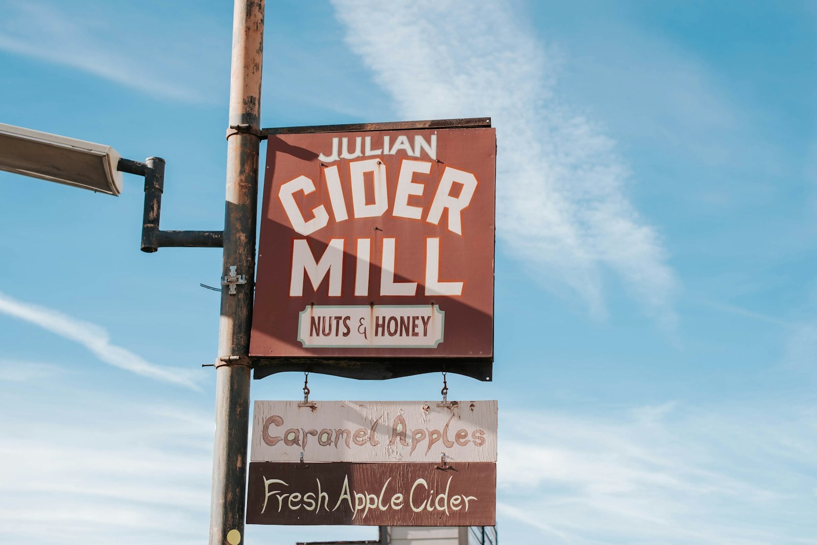 Historic Main Street in Julian beneath pine-covered mountains