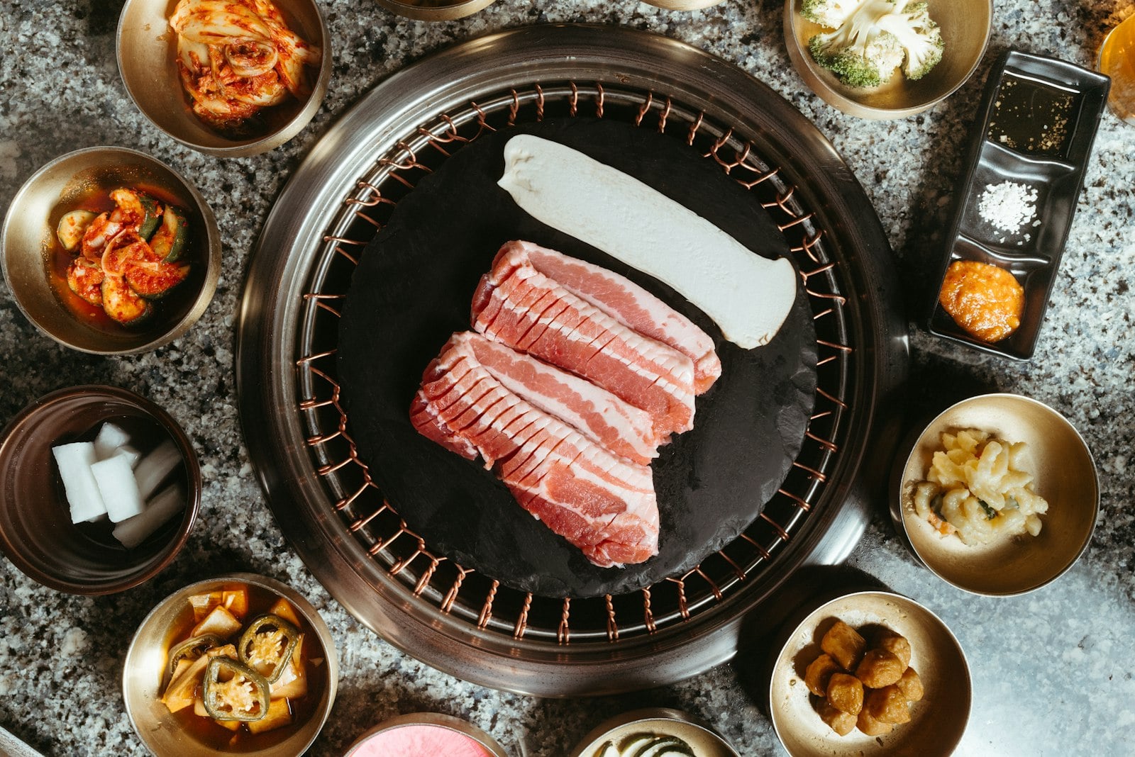Marinated galbi searing on a Korean barbecue tabletop grill in San Diego