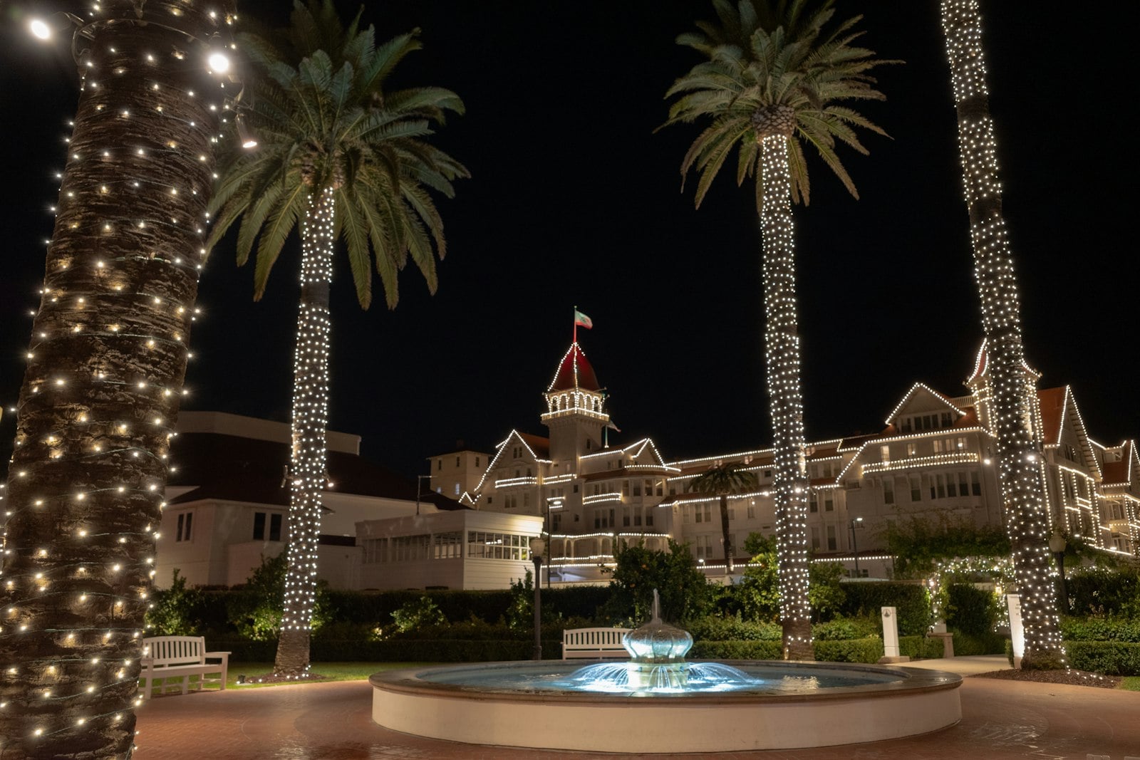 The red turrets of Hotel del Coronado above the beach at dusk