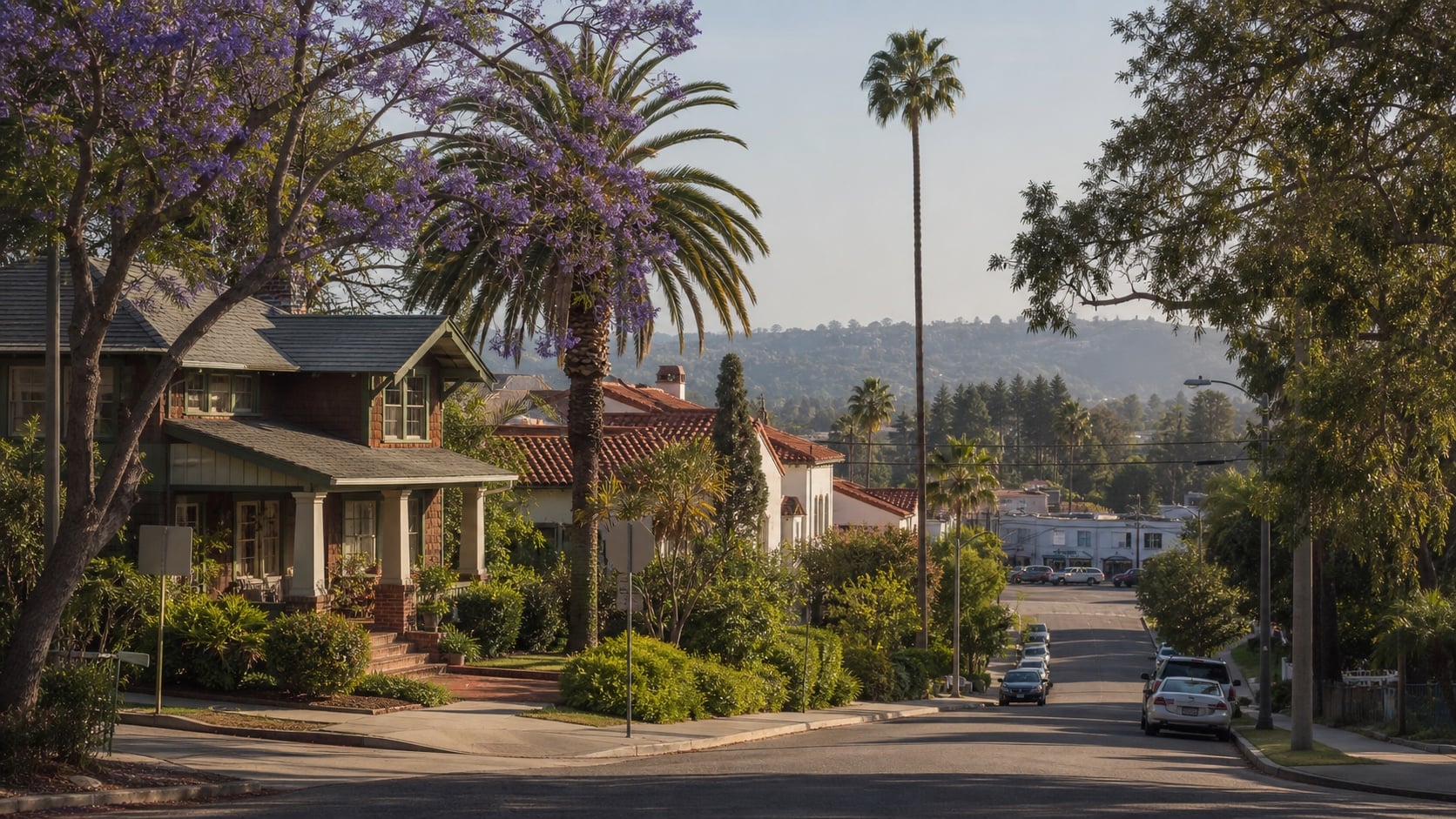 Historic Mission Hills homes beneath jacaranda trees and tall palms on a sloping street