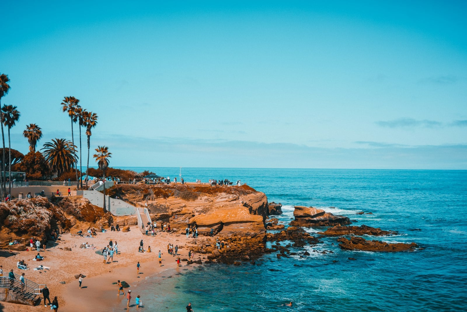 San Diego shoreline with a scattering of people on an October afternoon