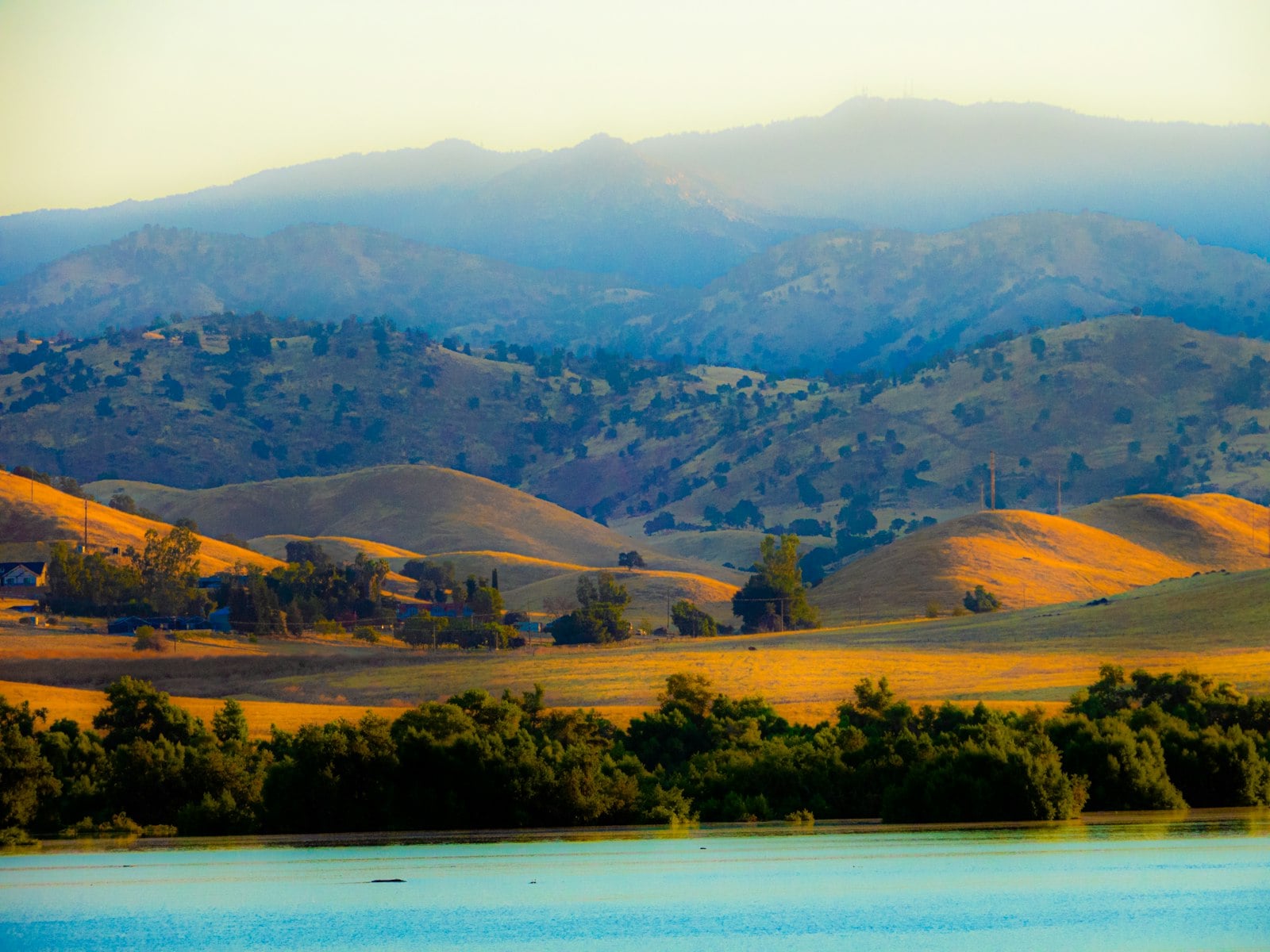 A reservoir below chaparral hills in inland San Diego County