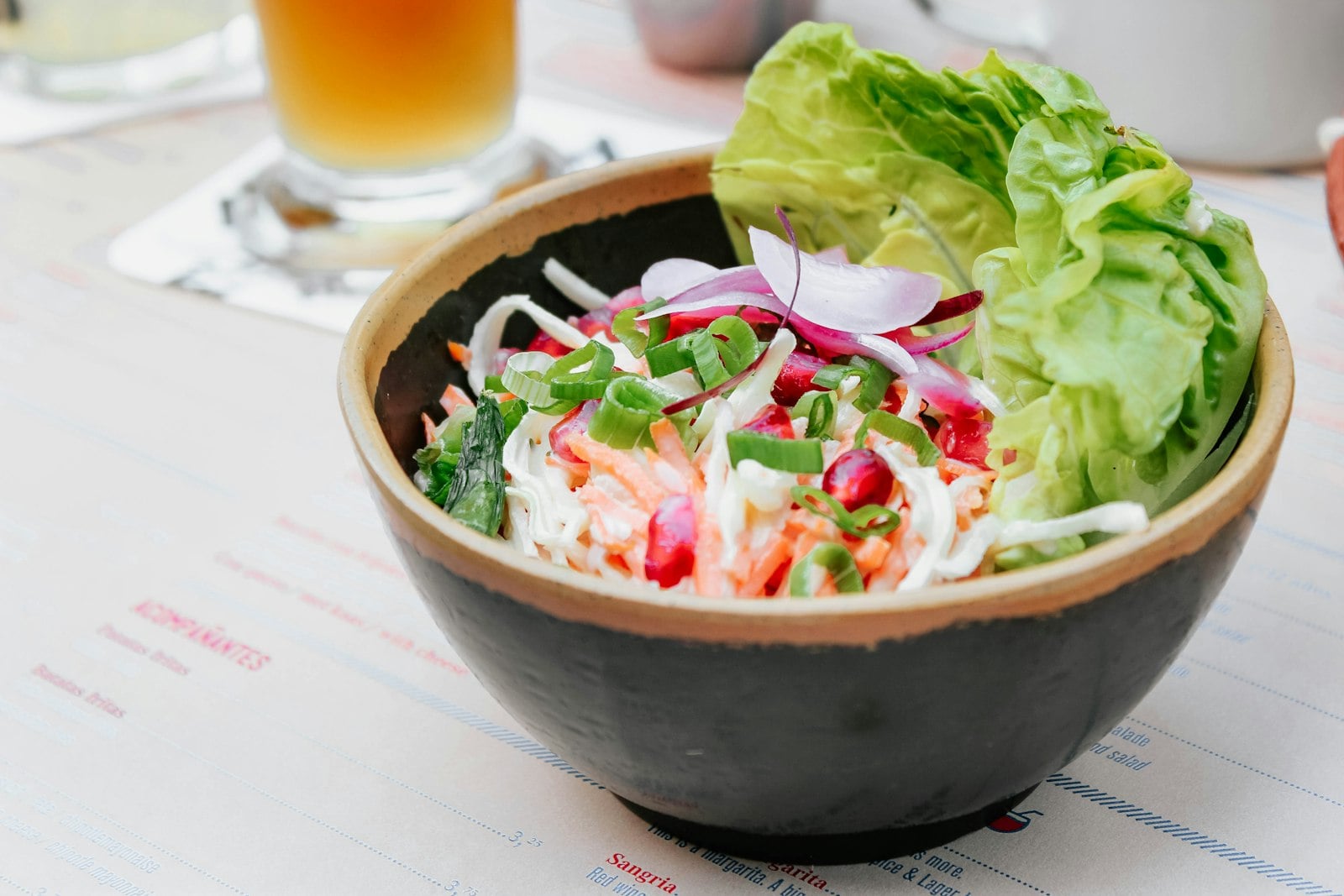 A shared bowl of food on a restaurant table