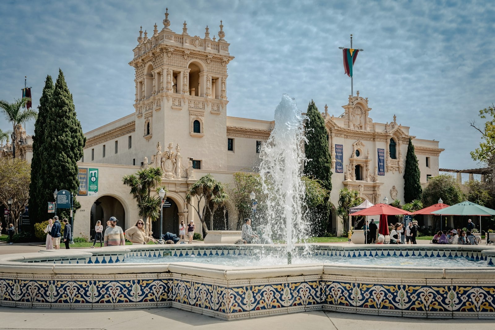 The fountain and colonnade outside a Balboa Park museum on a clear afternoon