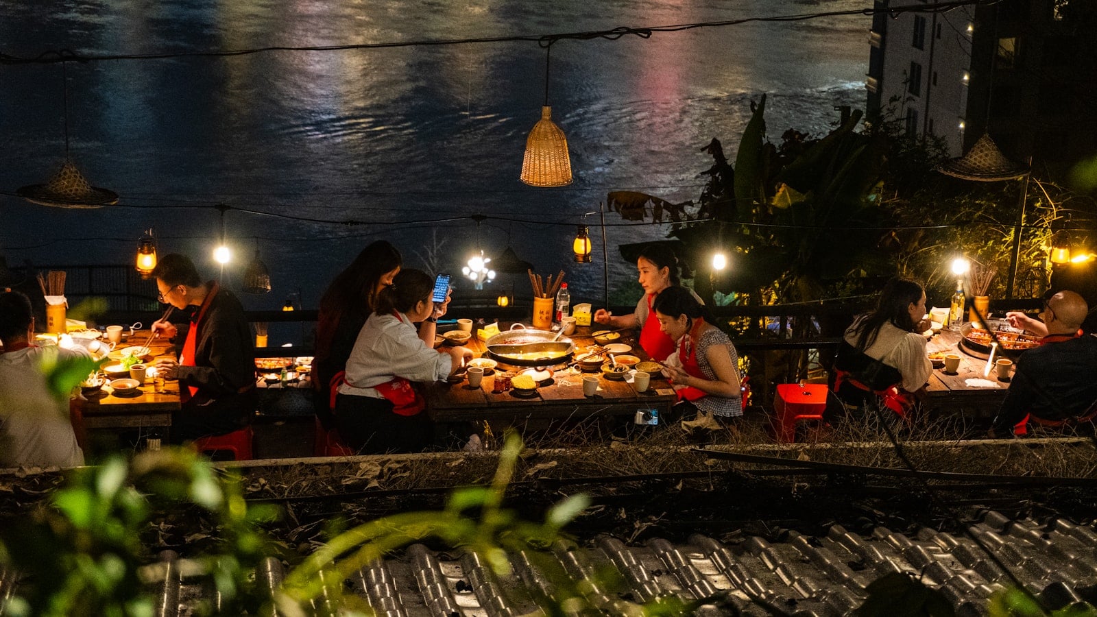 A hot pot dinner set out across a restaurant table