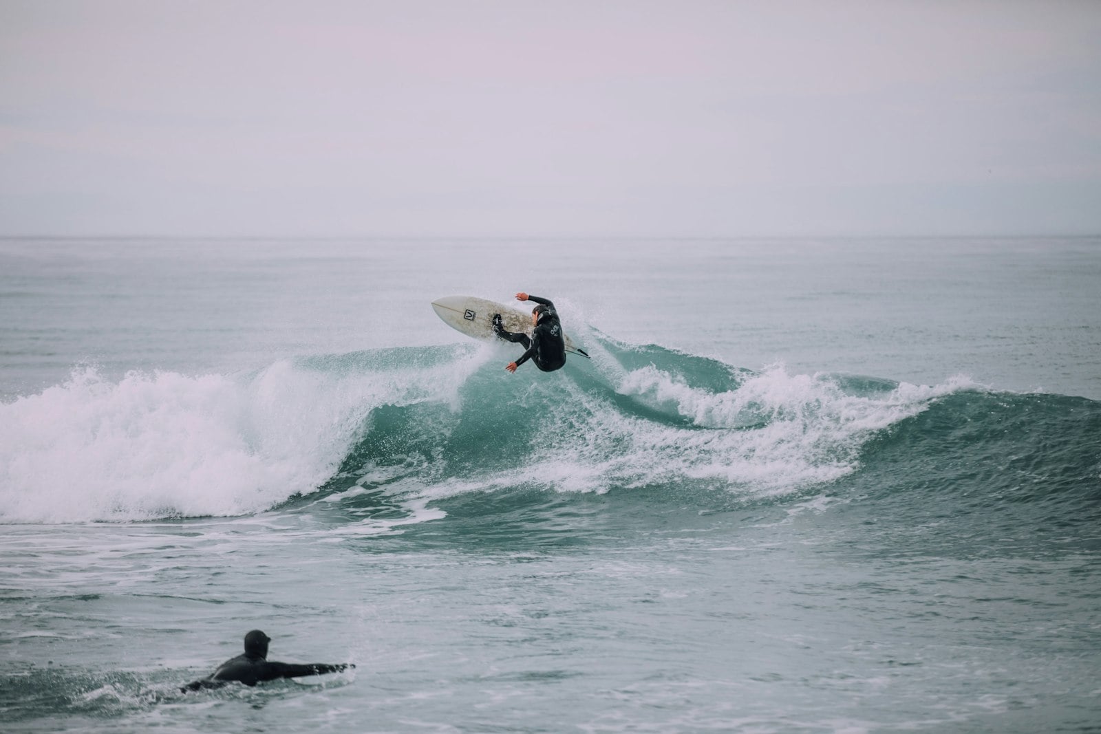 A beginner surfer practicing in San Diego whitewater