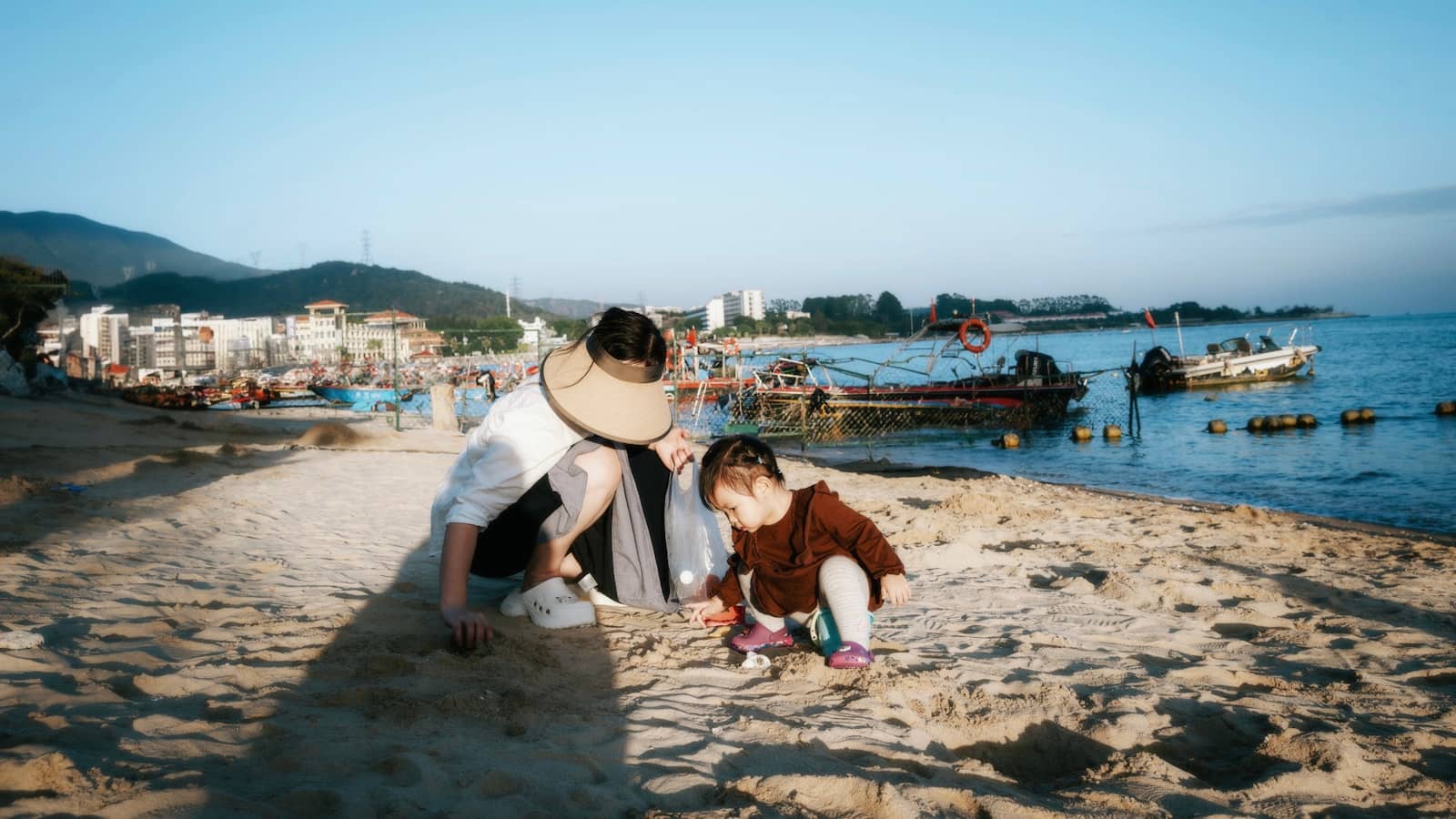 Small child playing at the water's edge