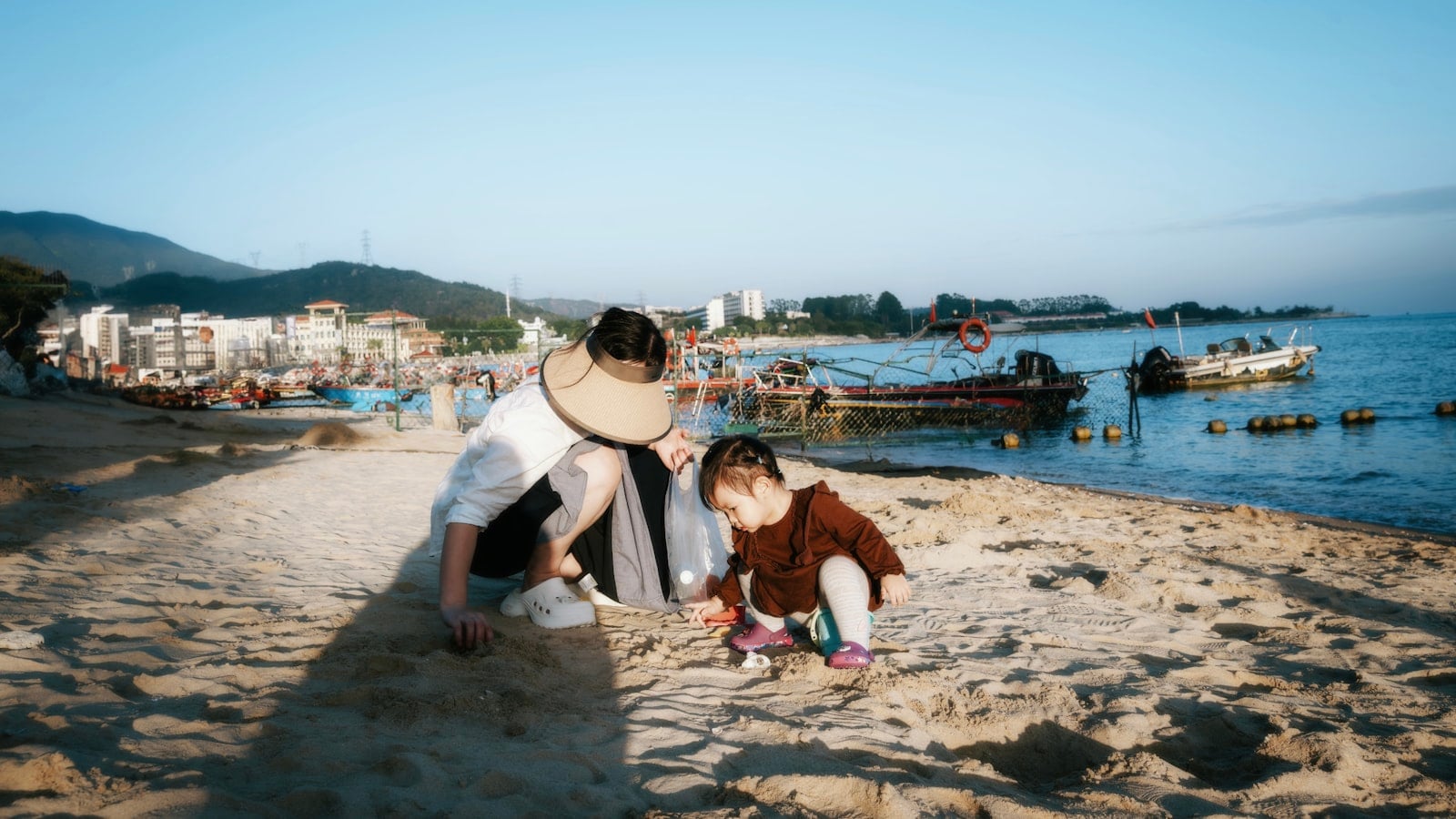 Small child playing at the water's edge