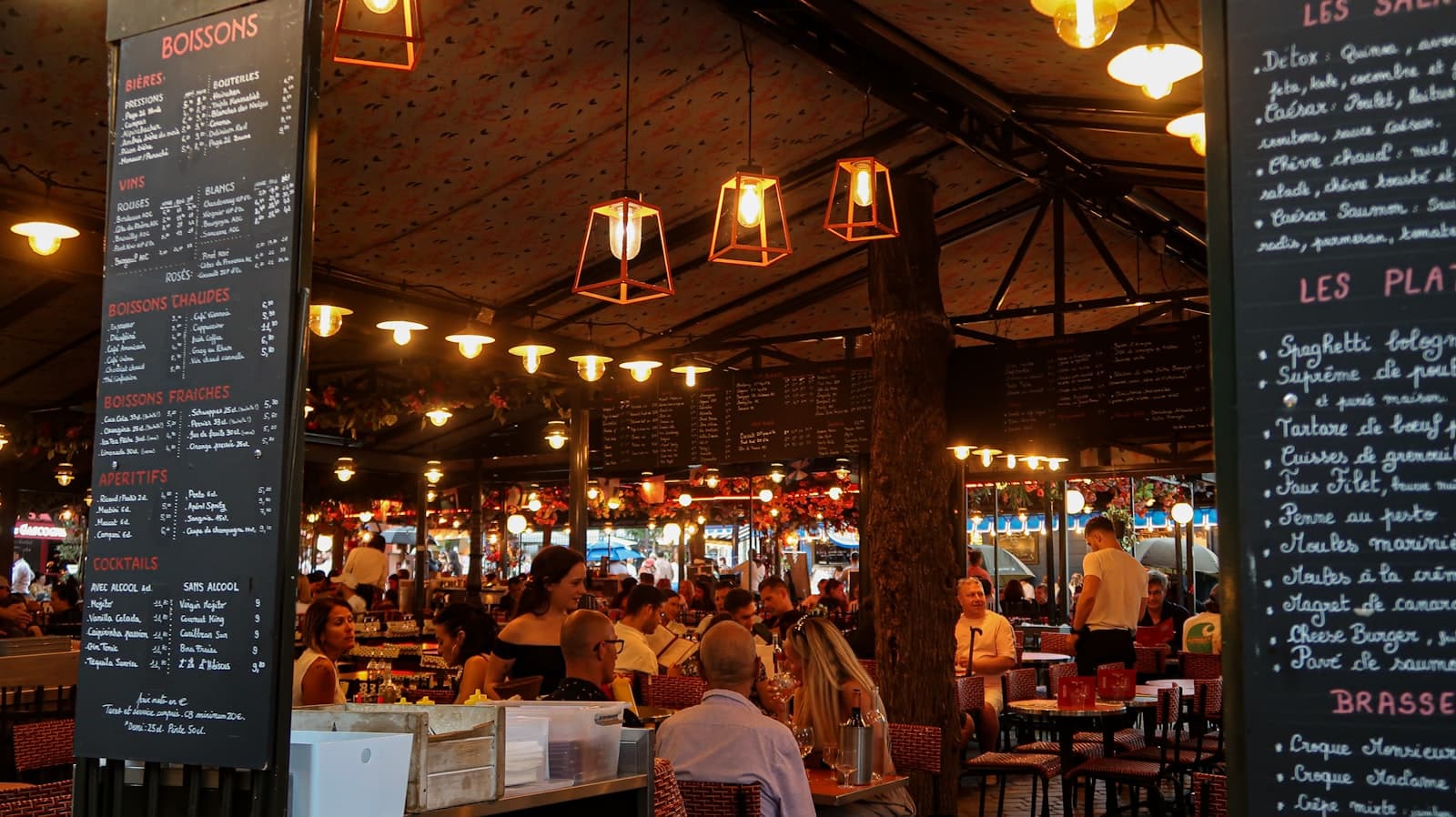 A busy restaurant dining room with people at tables
