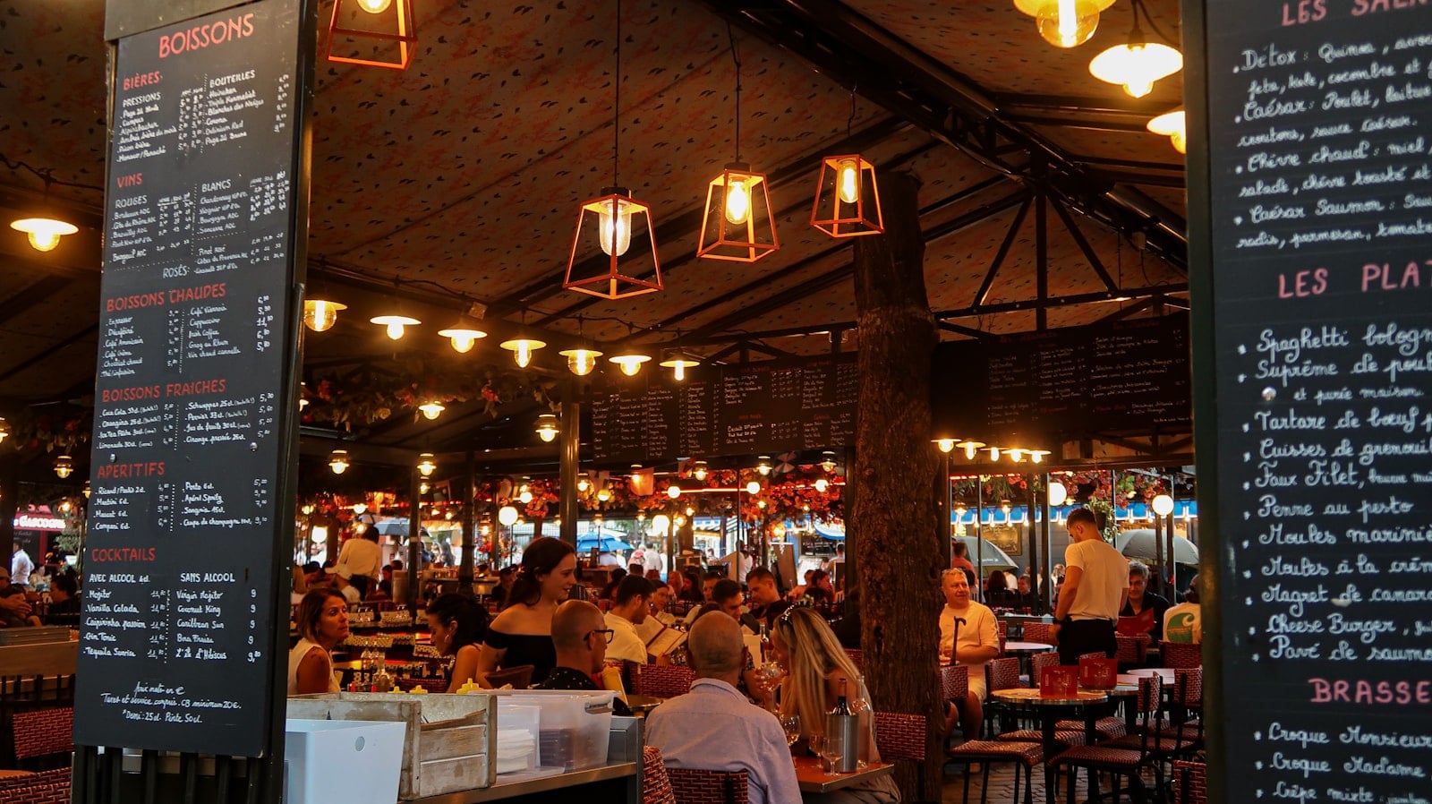 A busy restaurant dining room with people at tables