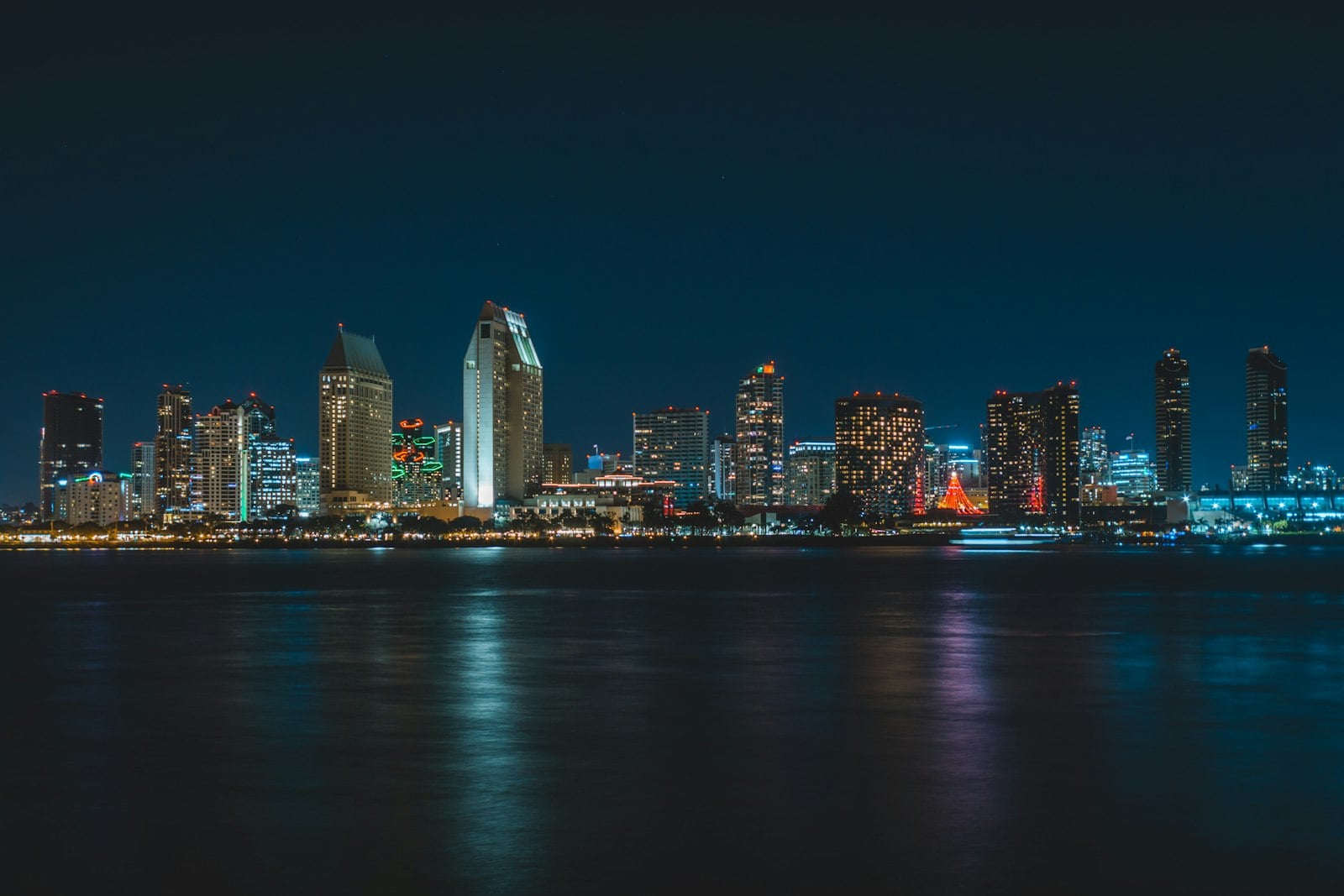 The San Diego skyline reflected across the bay after sunset